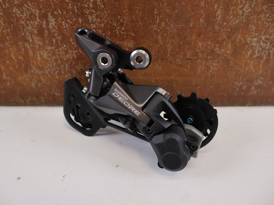SHIMANO DEORE RD-M5120 SCHALTWERK / 10/11-FACH / SHADOW RD+ / SGS LANG / 4550170618544