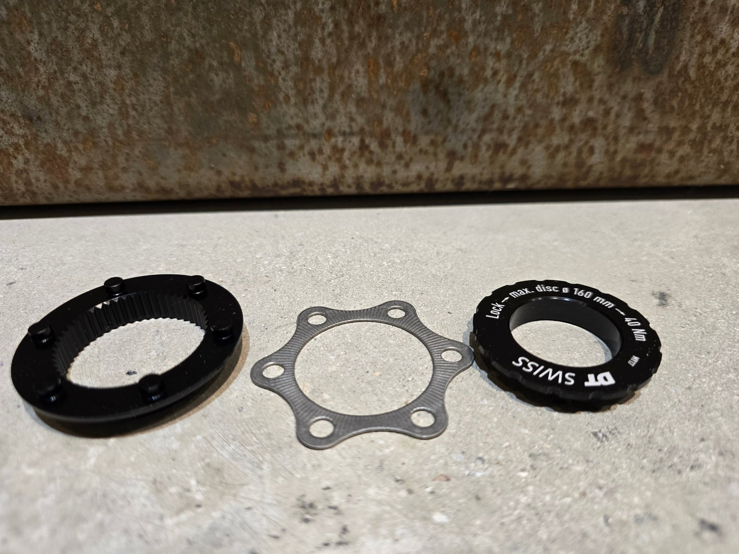 Zubehör von Dt Swiss, DT SWISS CENTER LOCK ADAPTER DISC MAX. 160MM in variant_title vor USEDBIKES - OB.DE Hintergrund