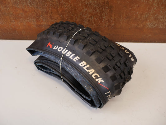 Reifen von Kenda, KENDA DOUBLE BLACK TRAIL 29 X 2.40 REIFEN SET 2 STÜCK vor USEDBIKES-OB.DE Hintergrund