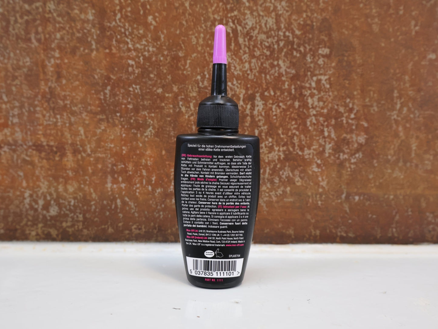 Pflege & Wartung von Muc - Off, MUC - OFF E - BIKE WET LUBE / KETTENSCHMIERMITTEL / 50 ML / KERAMIK - ZUSATZ vor USEDBIKES - OB.DE Hintergrund