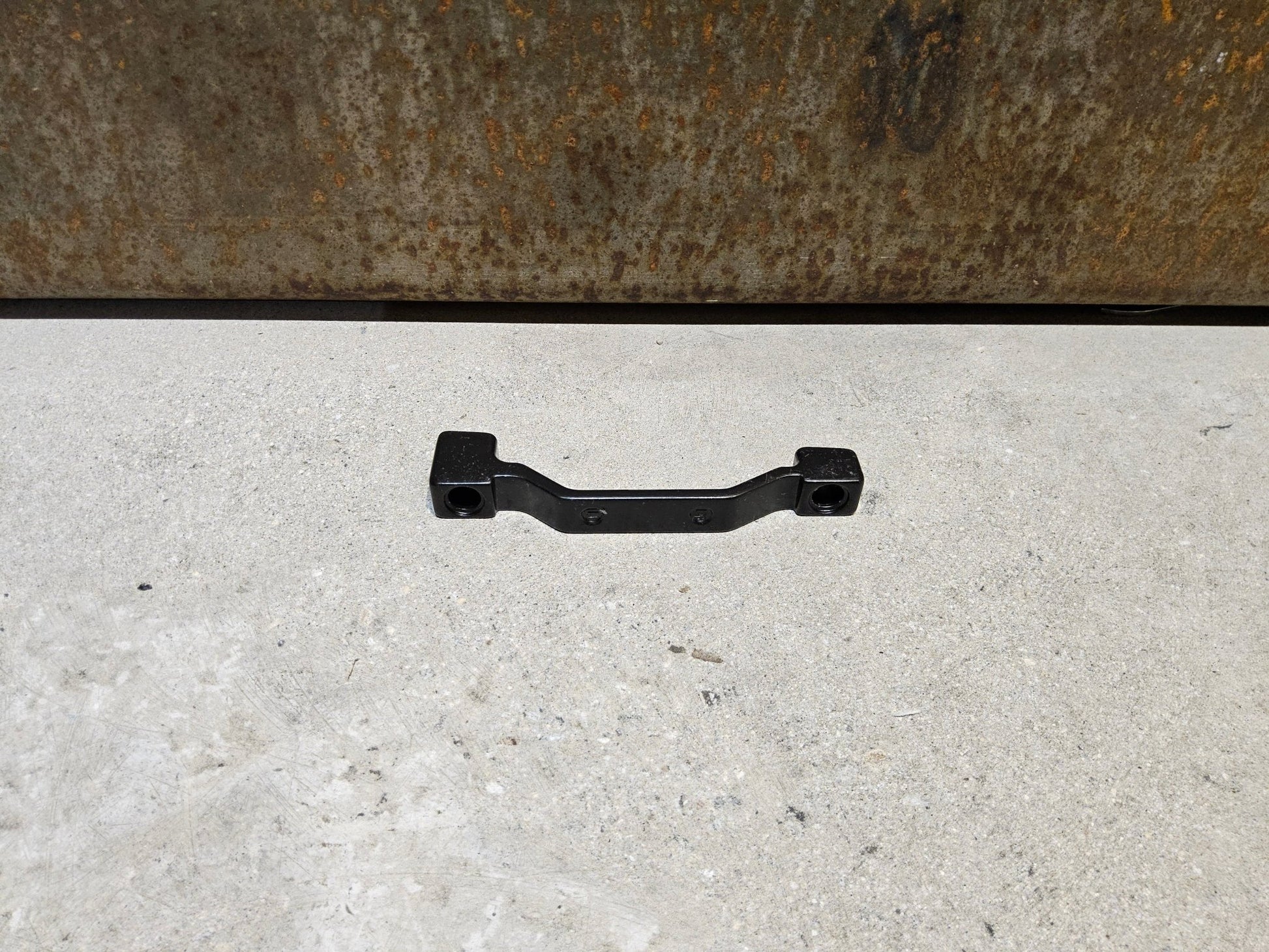 Zubehör von Shimano, SHIMANO ADAPTER POSTMOUNT 203MM / VORNE O. HINTEN vor USEDBIKES - OB.DE Hintergrund