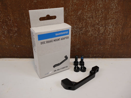 Bremsadapter von Shimano, SHIMANO ADAPTER SM-MA-R180P/S / IS 2000 RAHMEN AUF PM BREMSSATTEL / HR 180 MM vor USEDBIKES-OB.DE Hintergrund