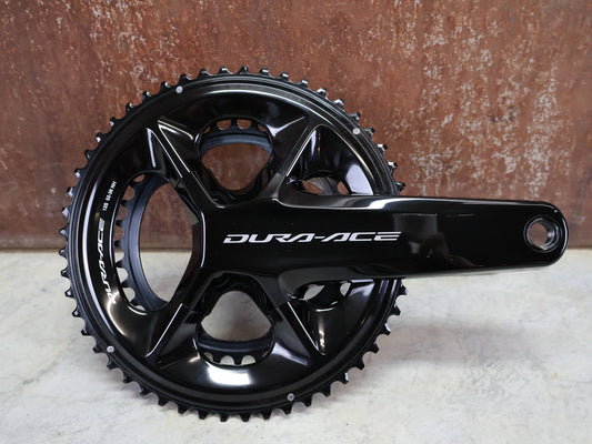 Kurbel von Shimano, SHIMANO DURA ACE FC - R9200 KURBELGARNITUR 2X11 FACH 52/36 ZÄHNE 172.5MM vor USEDBIKES - OB.DE Hintergrund