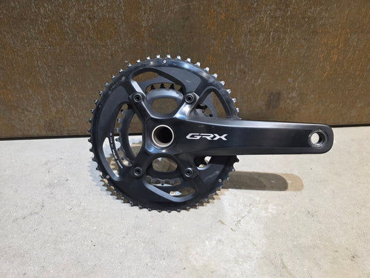 Kurbel von Shimano, SHIMANO GRX FC - RX810 KURBEL 11 FACH 48 - 31 ZÄHNE / 175MM vor USEDBIKES - OB.DE Hintergrund