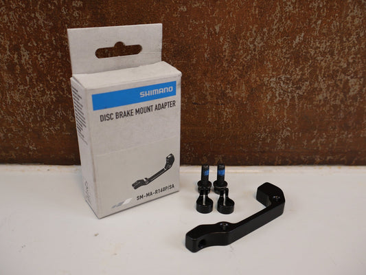 Bremsadapter von Shimano, SHIMANO HR BREMSSCHEIBEN ADAPTER SM-MA-R160P/S / IS 2000 vor USEDBIKES-OB.DE Hintergrund