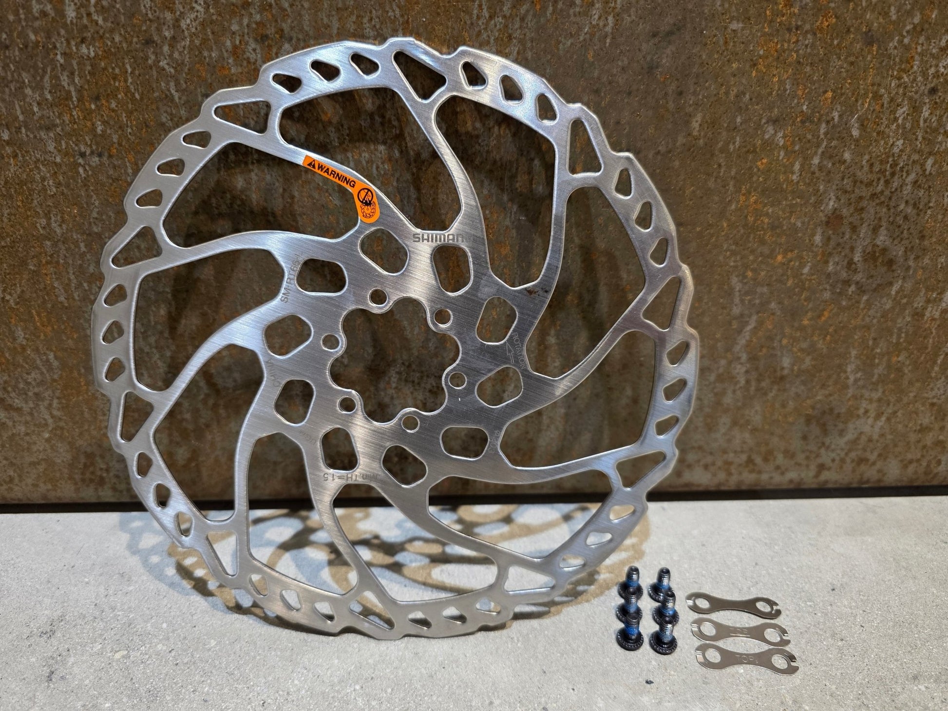 Bremsscheibe von Shimano, SHIMANO SLX BREMSSCHEIBE SM - RT66 - L 6 - LOCH / 203MM in variant_title vor USEDBIKES - OB.DE Hintergrund