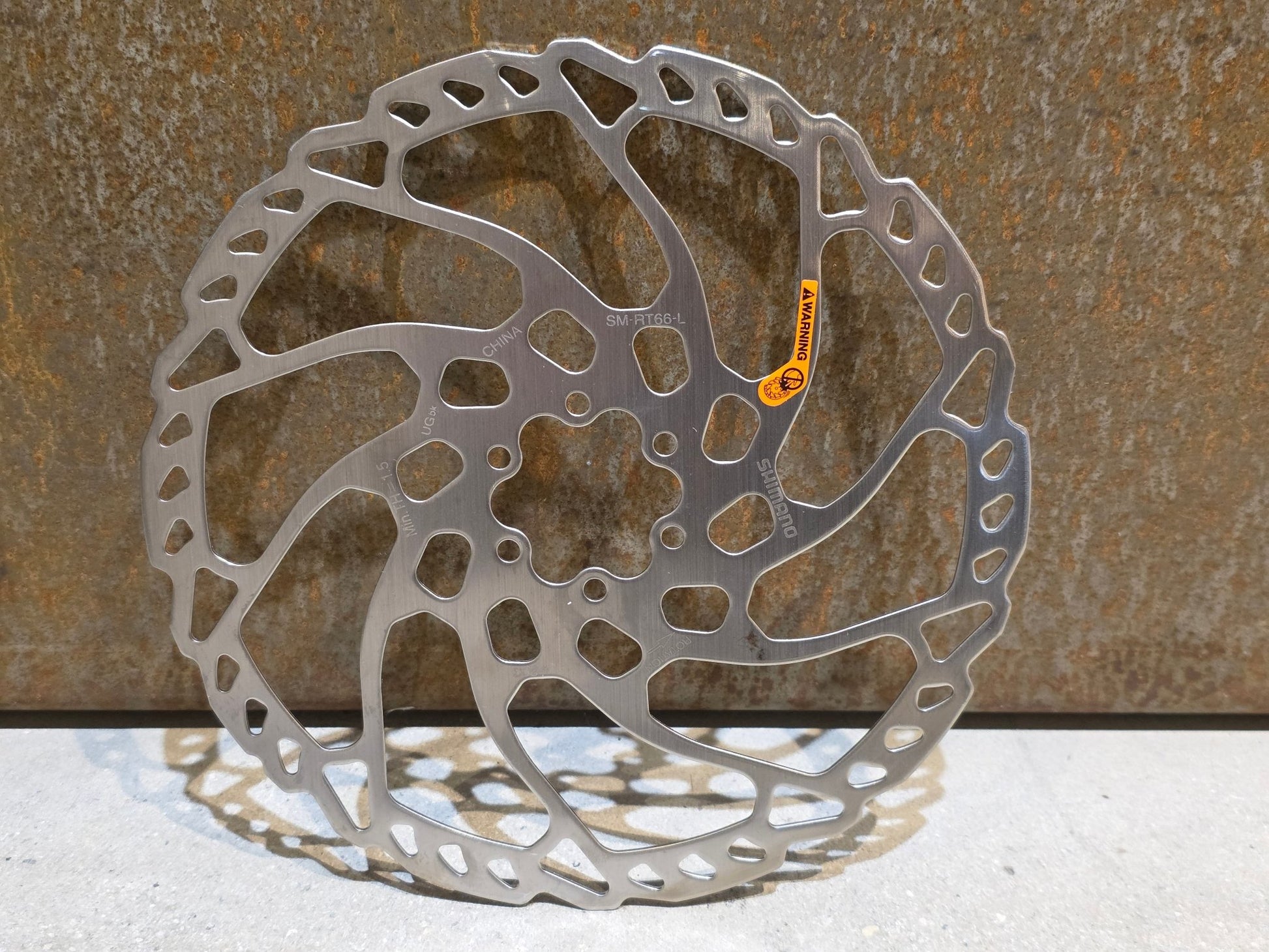 Bremsscheibe von Shimano, SHIMANO SLX BREMSSCHEIBE SM - RT66 - L 6 - LOCH / 203MM in variant_title vor USEDBIKES - OB.DE Hintergrund