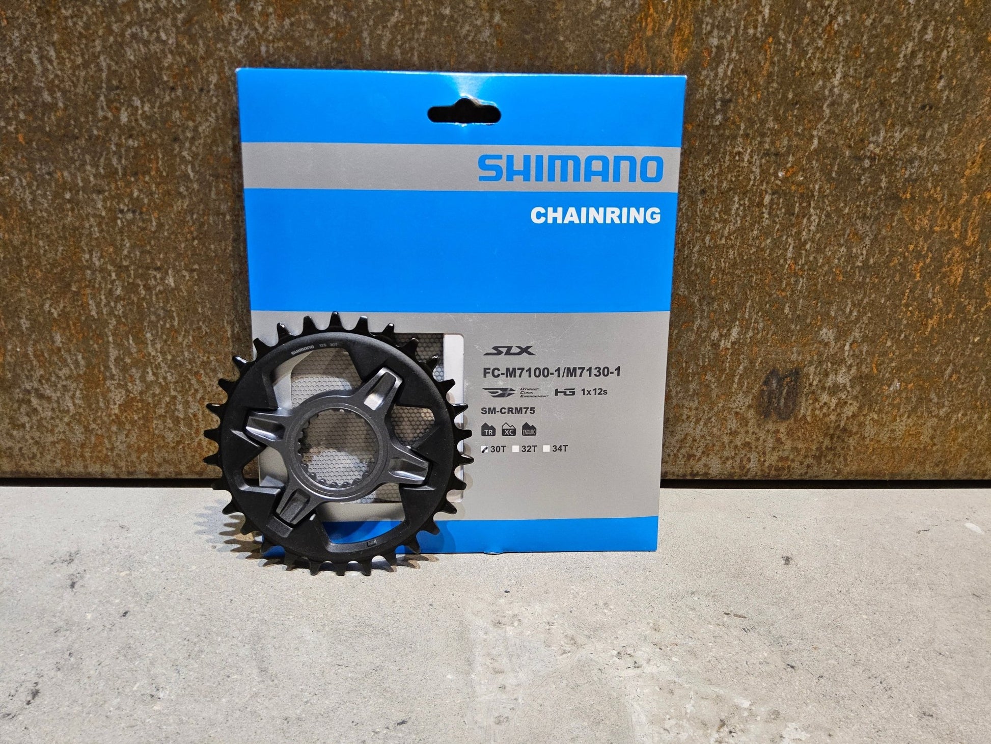 Kettenblatt von Shimano, SHIMANO SLX KETTENBLATT FC - M7100 / SM - CRM75 / 30 - 32 ZÄHNE in variant_title vor USEDBIKES - OB.DE Hintergrund