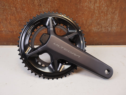 Kurbel von Shimano, Shimano Ultegra FC-R8100-P Powermeter Kurbel 172.5mm 50-34Z vor USEDBIKES-OB.DE Hintergrund