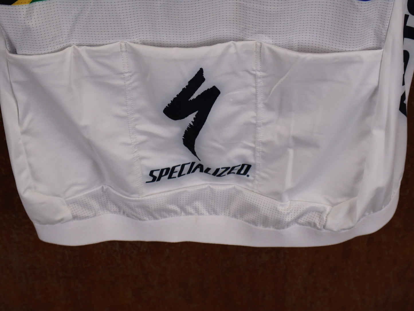 Kurzarm Trikot - BOH von Specialized, SPECIALIZED TGA ROOKIES OF RED BULL - BORA HANSGROHE RACE JERSEY SS / SOUTH AFRICA CHAMPION vor USEDBIKES - OB.DE Hintergrund