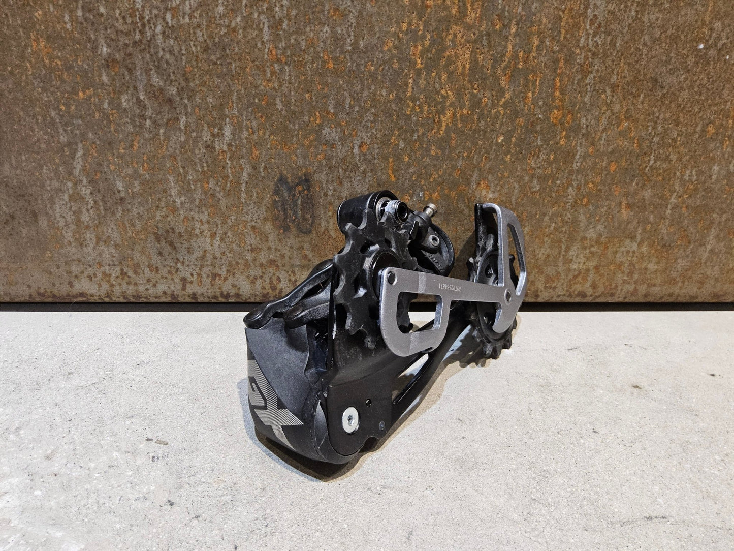 Schaltungsteile von Sram, SRAM GX EAGLE SCHALTWERK 12 FACH / MAX. 50 ZÄHNE vor USEDBIKES - OB.DE Hintergrund
