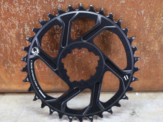 Kettenblatt von Sram, SRAM KETTENBLATT X - SYNC 2 XX1 EAGLE 3 BOLT DIRECT MOUNT 30T / 32T / 34T / 36T 3MM vor USEDBIKES - OB.DE Hintergrund