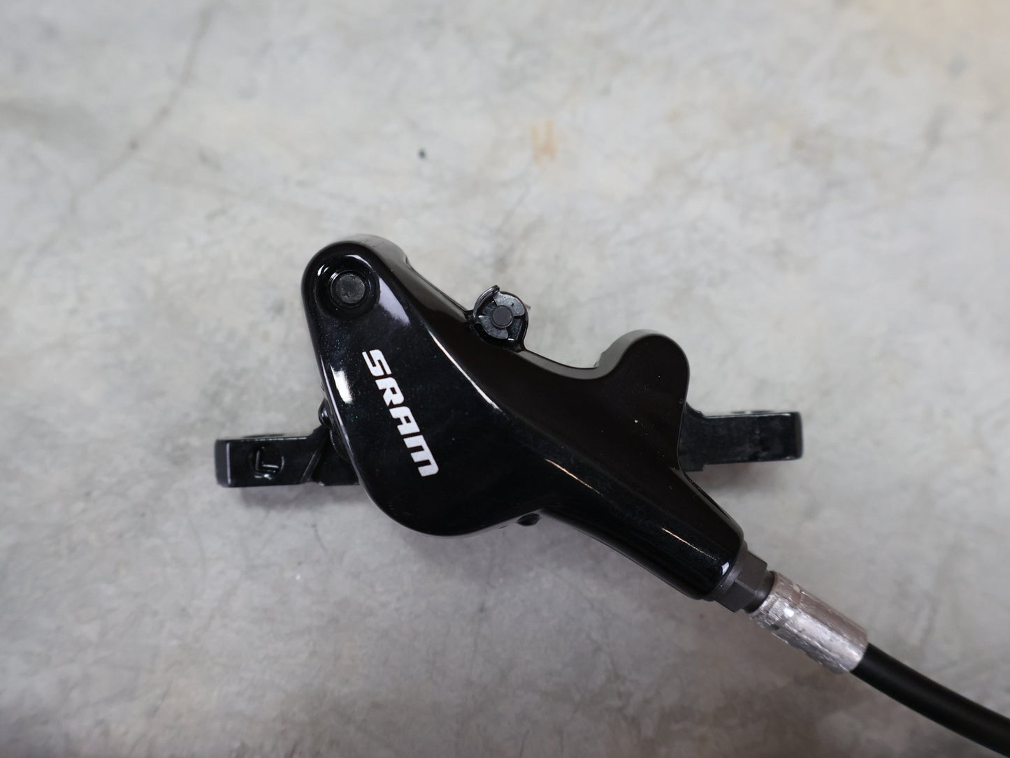 Bremse von Sram, SRAM LEVEL TL BREMSSET VORNE U. HINTEN SCHWARZ vor USEDBIKES - OB.DE Hintergrund