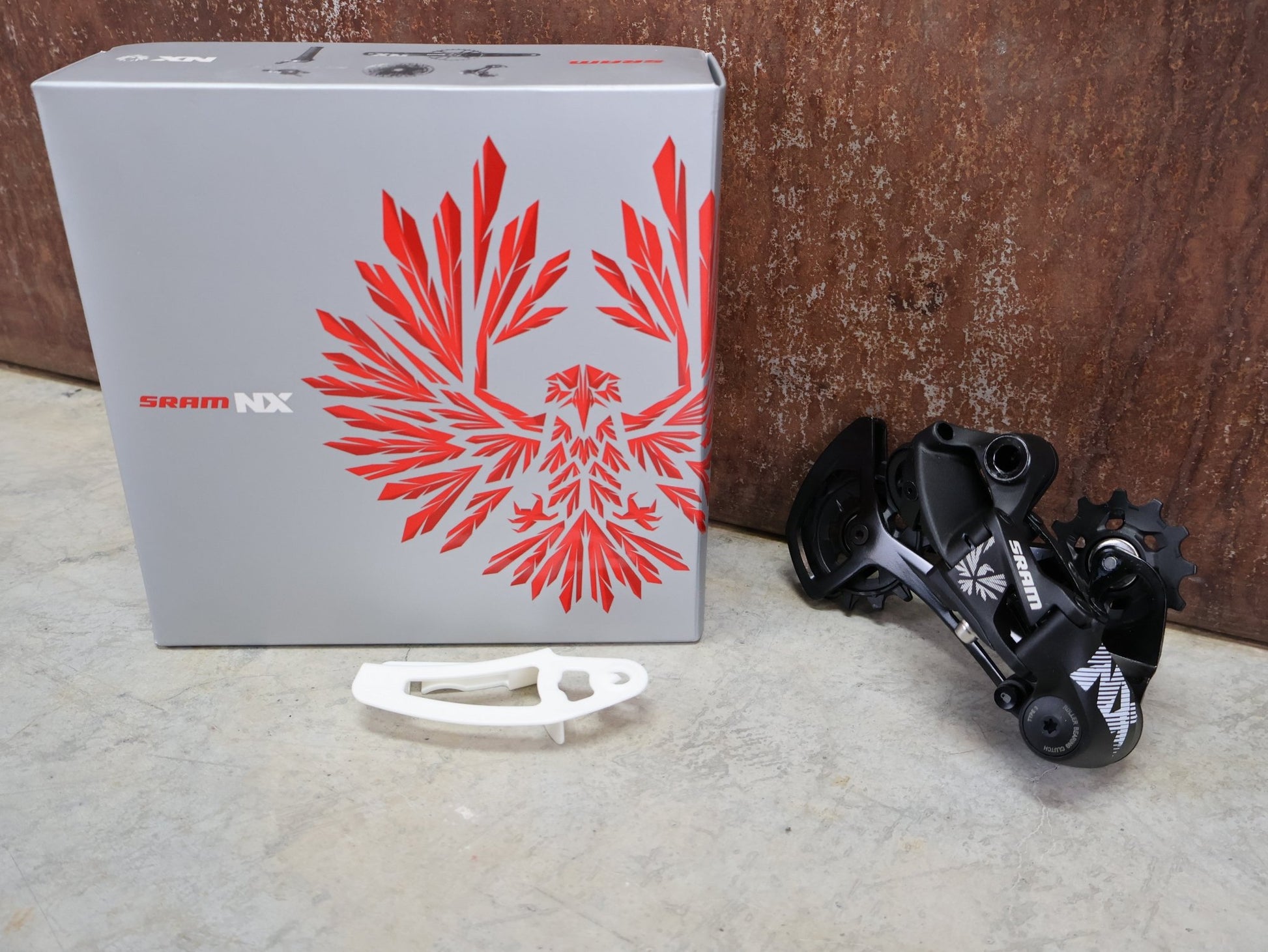 Schaltungsteile von Sram, SRAM NX EAGLE SCHALTWERK 12 FACH vor USEDBIKES - OB.DE Hintergrund