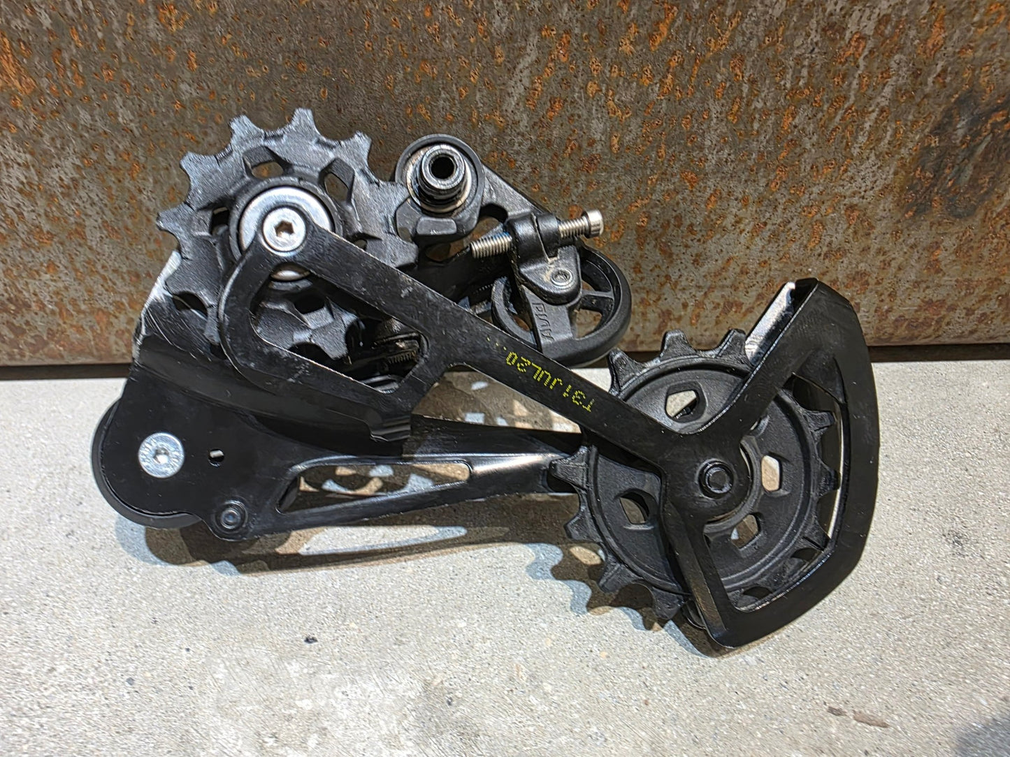 Schaltungsteile von Sram, SRAM NX EAGLE SCHALTWERK 12 FACH vor USEDBIKES - OB.DE Hintergrund