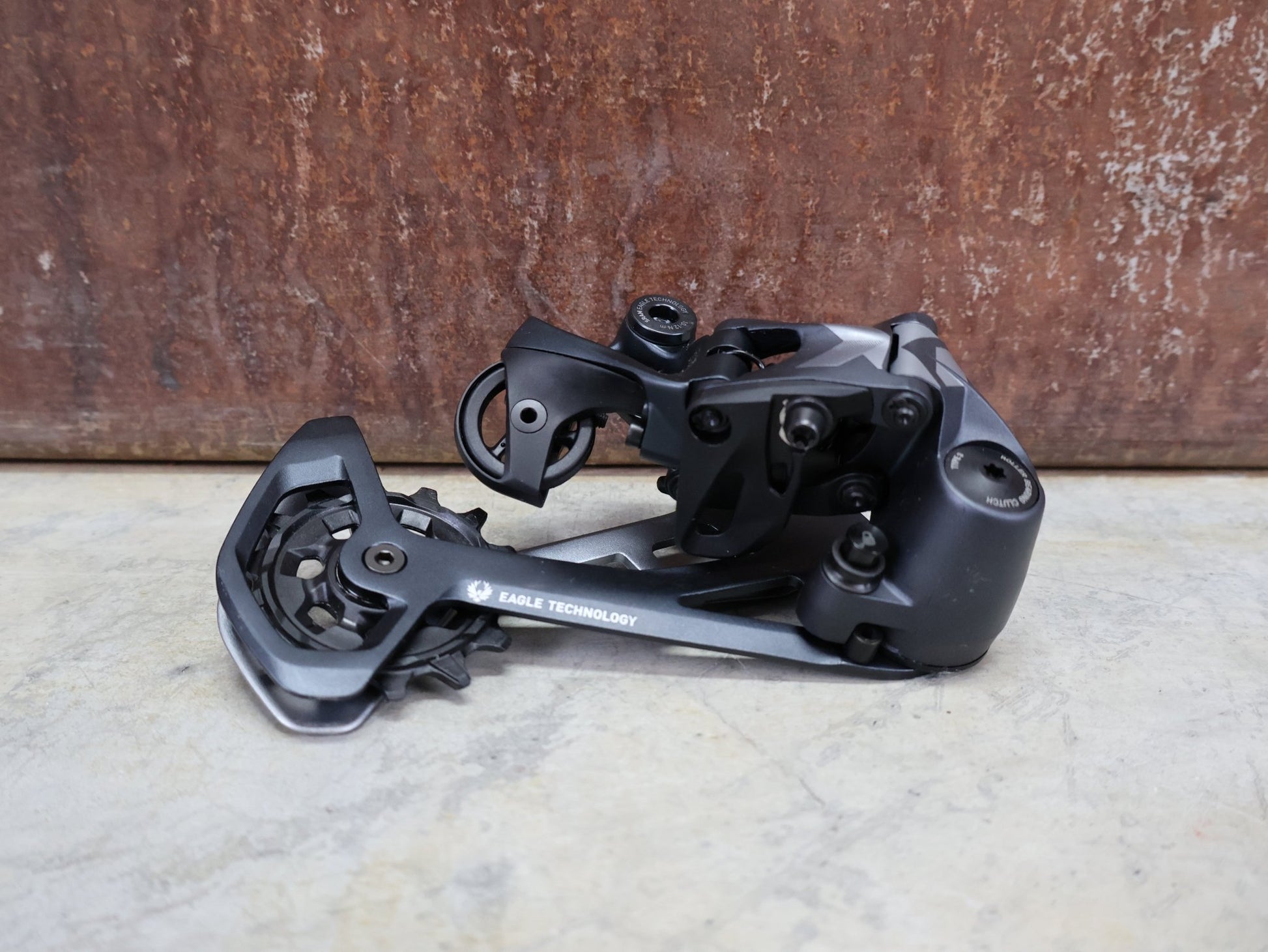 Schaltungsteile von Sram, SRAM X01 EAGLE SCHALTWERK 520% 12 FACH vor USEDBIKES - OB.DE Hintergrund