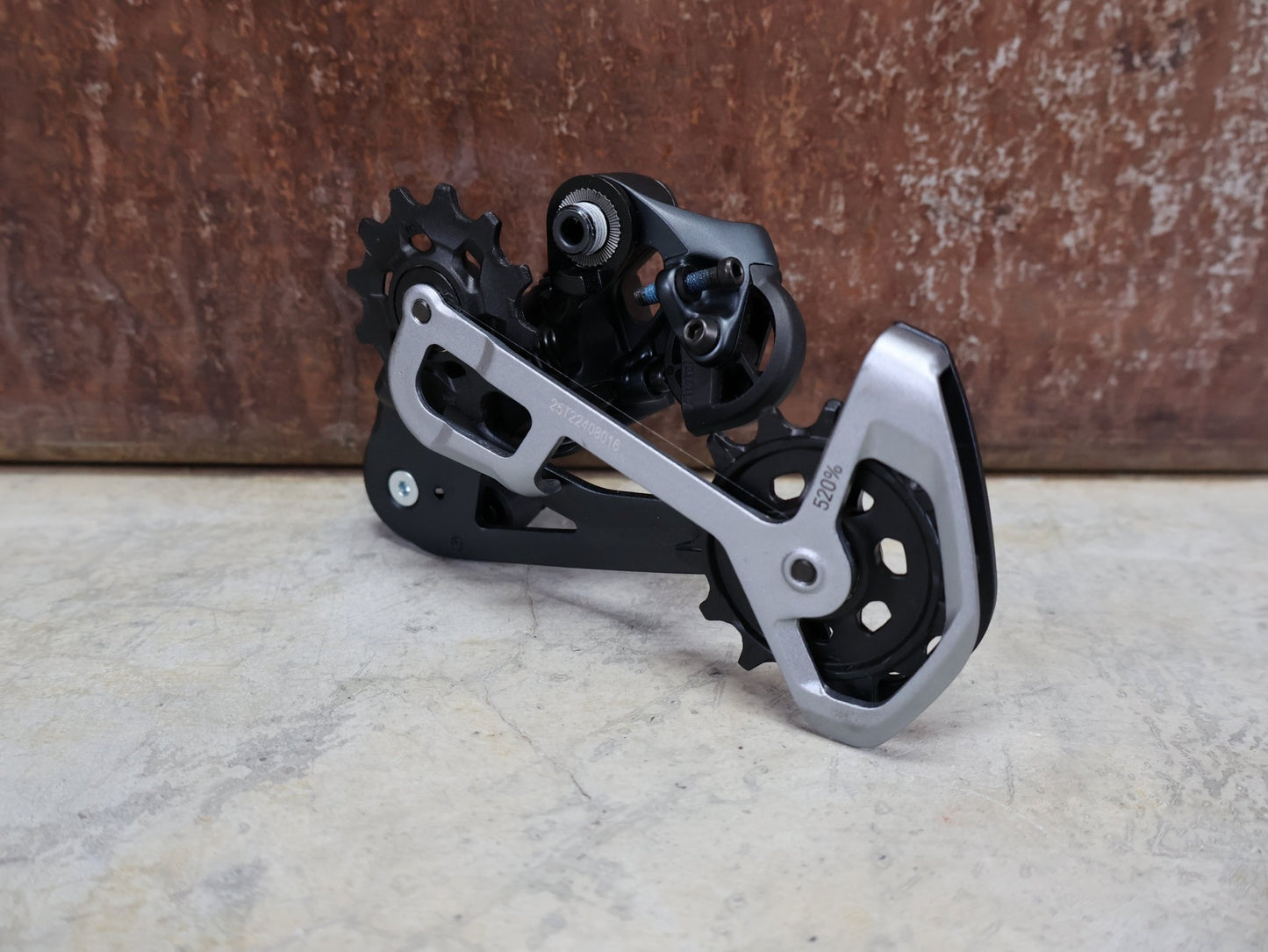 Schaltungsteile von Sram, SRAM X01 EAGLE SCHALTWERK 520% 12 FACH vor USEDBIKES - OB.DE Hintergrund