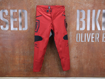 Hosen Herren von 100%, 100% – R - CORE X PANTS / RED - BLACK / TREK FACTORY RACING TEAM / 4 - WAY STRETCH vor USEDBIKES - OB.DE Hintergrund