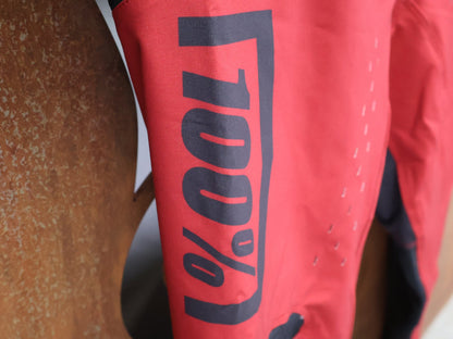 Hosen Herren von 100%, 100% – R - CORE X PANTS / RED - BLACK / TREK FACTORY RACING TEAM / 4 - WAY STRETCH vor USEDBIKES - OB.DE Hintergrund