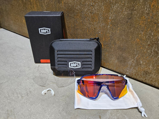 Brillen von 100%, 100 % SONNENBRILLE TREK TEAM EDITION S3 HIPER LENS vor USEDBIKES - OB.DE Hintergrund