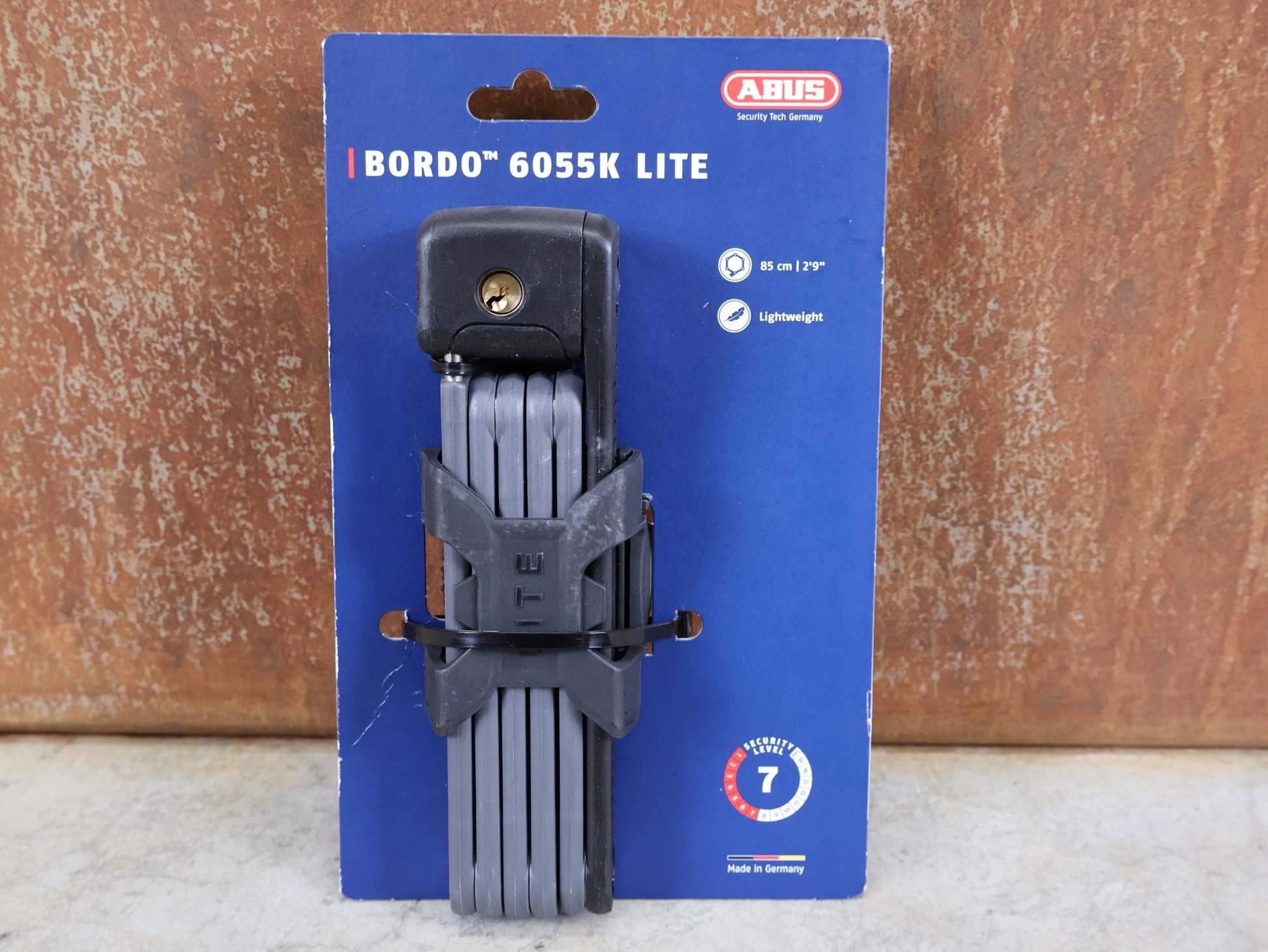 Fahrradschlösser von Abus, ABUS BORDO LITE 6055 MINI / 85 CM – FALTSCHLOSS – SECURITY LEVEL 7 – INKL. SH 6055 HALTER – SCHWARZ vor USEDBIKES - OB.DE Hintergrund