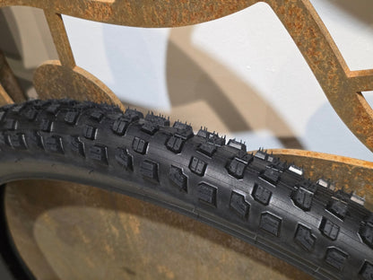Reifen von Bontrager, BONTRAGER GUNNISON ELITE XR TLR MOUNTAINBIKE REIFEN 27.5X2.40 in variant_title vor USEDBIKES - OB.DE Hintergrund