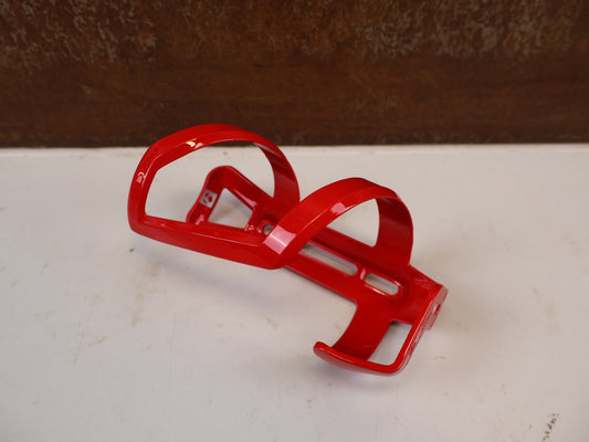 Trinkflaschen und Halter von Bontrager, BONTRAGER LEFT SIDE LOAD FLASCHENHALTER RED RECYCLED vor USEDBIKES-OB.DE Hintergrund