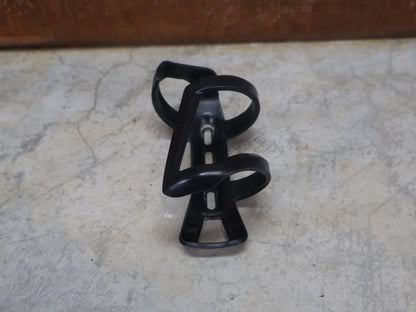 Trinkflaschen und Halter von Bontrager, BONTRAGER RIGHT SIDE LOAD RECYCLED FLASCHENHALTER / SCHWARZ OEM vor USEDBIKES - OB.DE Hintergrund