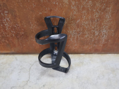 Trinkflaschen und Halter von Bontrager, BONTRAGER RIGHT SIDE LOAD RECYCLED FLASCHENHALTER / SCHWARZ OEM vor USEDBIKES - OB.DE Hintergrund