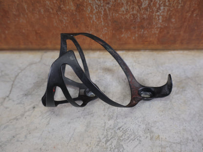 Trinkflaschen und Halter von Bontrager, BONTRAGER XXX FLASCHENHALTER / OCLV CARBON / SCHWARZ MATT – 20 G vor USEDBIKES - OB.DE Hintergrund