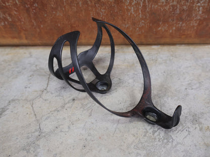 Trinkflaschen und Halter von Bontrager, BONTRAGER XXX FLASCHENHALTER / OCLV CARBON / SCHWARZ MATT – 20 G vor USEDBIKES - OB.DE Hintergrund