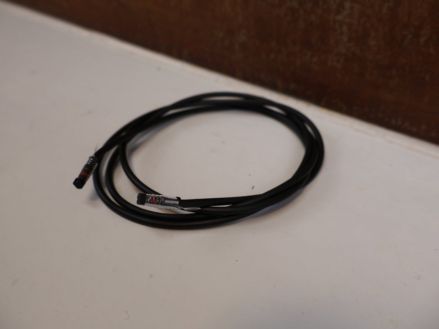 Zubehör von Bosch, BOSCH DISPLAY - KABEL HMI BCH3611_1300 SMARTES SYSTEM / 1300 MM / EB12120006 vor USEDBIKES - OB.DE Hintergrund