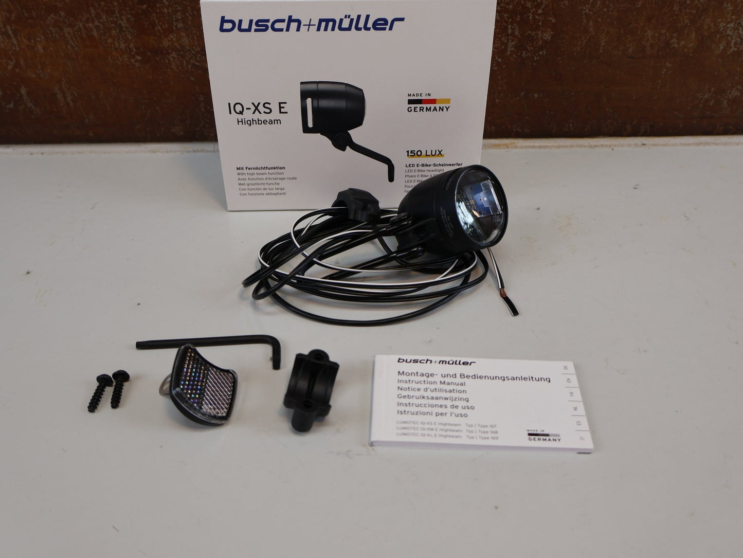 Sonstiges von busch+müller, BUSCH MÜLLER IQ-XS E HIGHBEAM / E-BIKE SCHEINWERFER / 150 LUX / FERNLICHT vor USEDBIKES-OB.DE Hintergrund