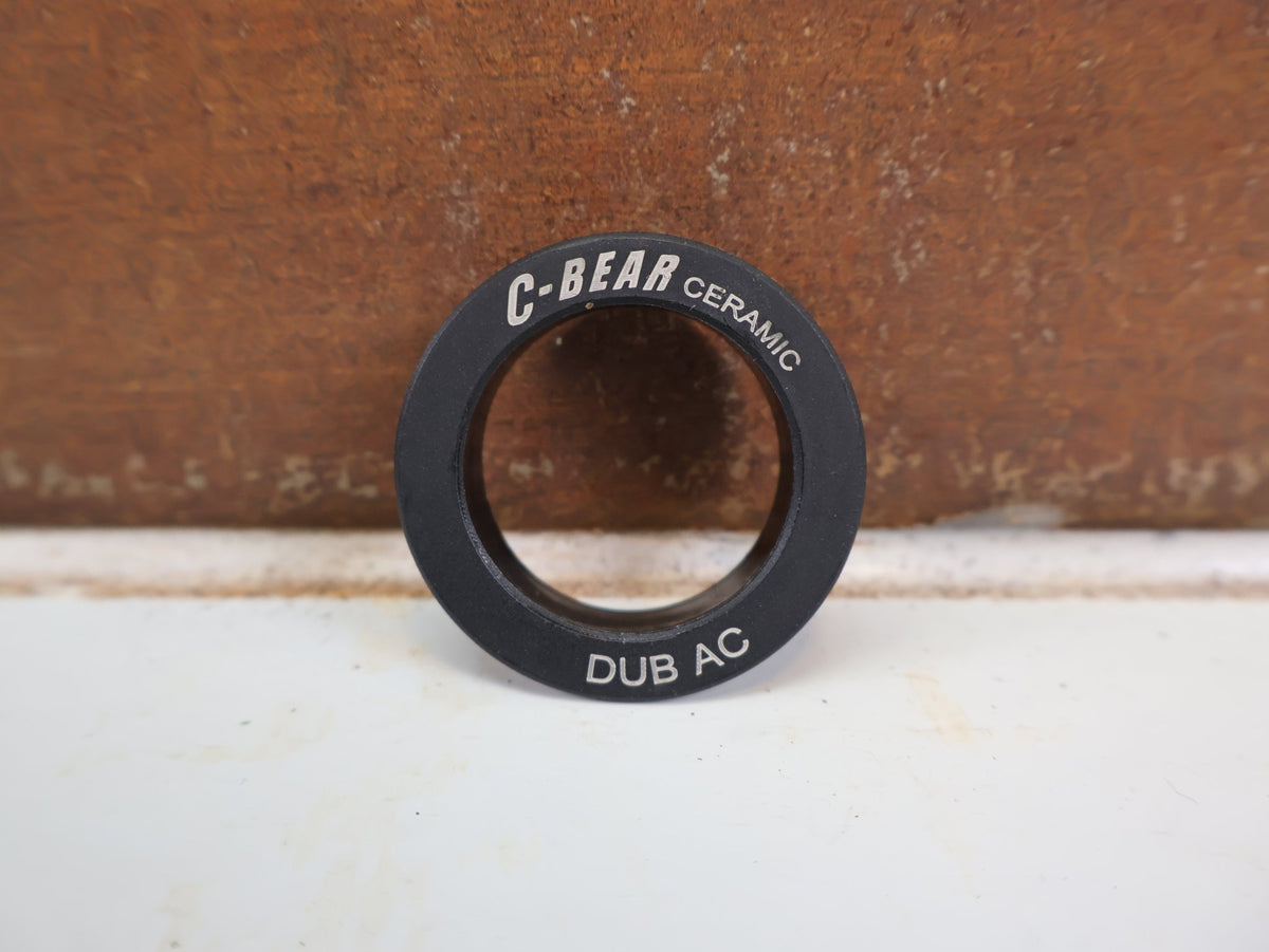 Innenlager von C-Bear, C-BEAR DUB DUST COVER ERSATZ ABDECKUNG KERAMIK INNENLAGER 2 STÜCK vor USEDBIKES-OB.DE Hintergrund