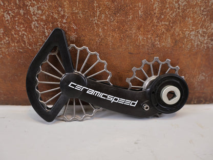 Schaltungsteile von Ceramicspeed, CeramicSpeed 3D Ti OSPW SRAM RED FORCE AXS 12f Coated vor USEDBIKES-OB.DE Hintergrund