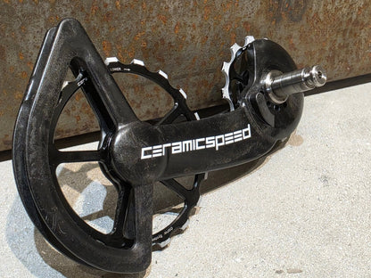 Schaltungsteile von Ceramicspeed, CERAMICSPEED OSPW COATED SHIMANO R9100 DURA ACE / R8000 ULTEGRA vor USEDBIKES - OB.DE Hintergrund