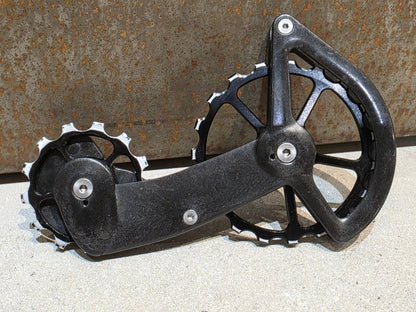 Schaltungsteile von Ceramicspeed, CERAMICSPEED OSPW COATED SHIMANO R9100 DURA ACE / R8000 ULTEGRA vor USEDBIKES - OB.DE Hintergrund