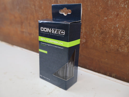 Zubehör von Contec, CONTEC SPACER BOX 24-TEILIG ALU 1 1/8 ZOLL 2-20MM SCHWARZ vor USEDBIKES-OB.DE Hintergrund