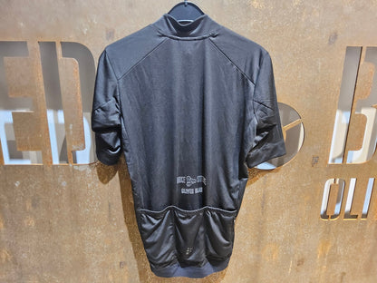 Trikot Herren von Craft, CRAFT ESSENCE BIKESTORE SS JERSEY - HERREN - KURZARM TRIKOT - BLACK in variant_title vor USEDBIKES - OB.DE Hintergrund