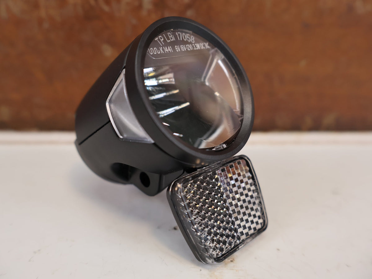 Beleuchtung von Herrmans, HERRMANS MR8 E-BIKE SCHEINWERFER FRONTLICHT 6-12V SCHWARZ vor USEDBIKES-OB.DE Hintergrund