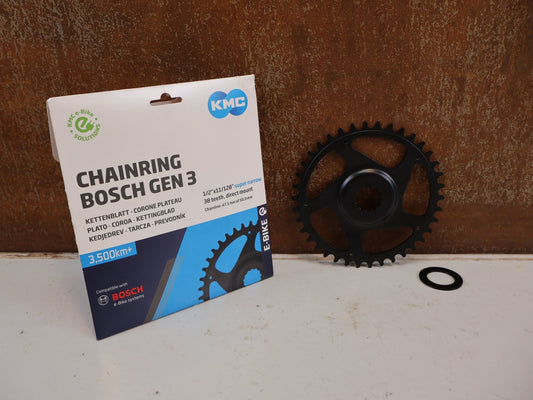 Kettenblatt von Kmc, KMC BOSCH GEN 3 E-BIKE KETTENBLATT 38 ZÄHNE 3MM OFFSET CRMO vor USEDBIKES-OB.DE Hintergrund