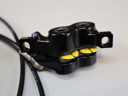 Bremse von Magura, MAGURA MT5 SCHEIBENBREMSE / 4 - KOLBEN / CARBOTECTURE / S - PEDELEC READY / 2700477 vor USEDBIKES - OB.DE Hintergrund