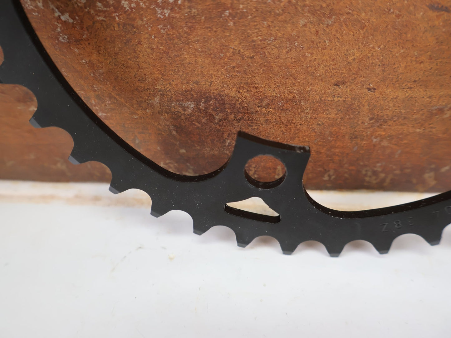 Kettenblatt von Miche, MICHE E-BIKE KETTENBLATT 104 MM 4-ARM SCHWARZ / HAN CGEB0B0434B00 vor USEDBIKES-OB.DE Hintergrund
