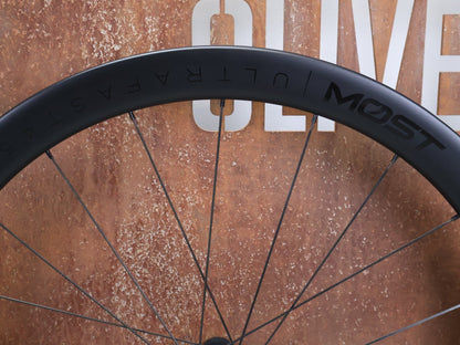 Laufrad/Laufradsatz von Most, MOST ULTRAFAST 45 TLR DB LAUFRADSATZ DISC vor USEDBIKES - OB.DE Hintergrund