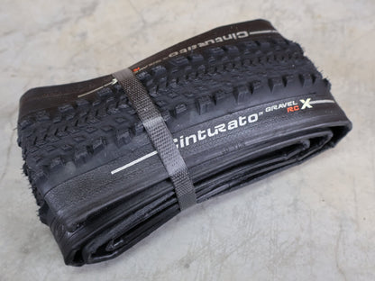 Reifen von Pirelli, PIRELLI CINTURATO GRAVEL RC - X GRAVELREIFEN / 700C X 40 MM – TUBELESS READY – TECHWALL X – SPEEDGRIP vor USEDBIKES - OB.DE Hintergrund