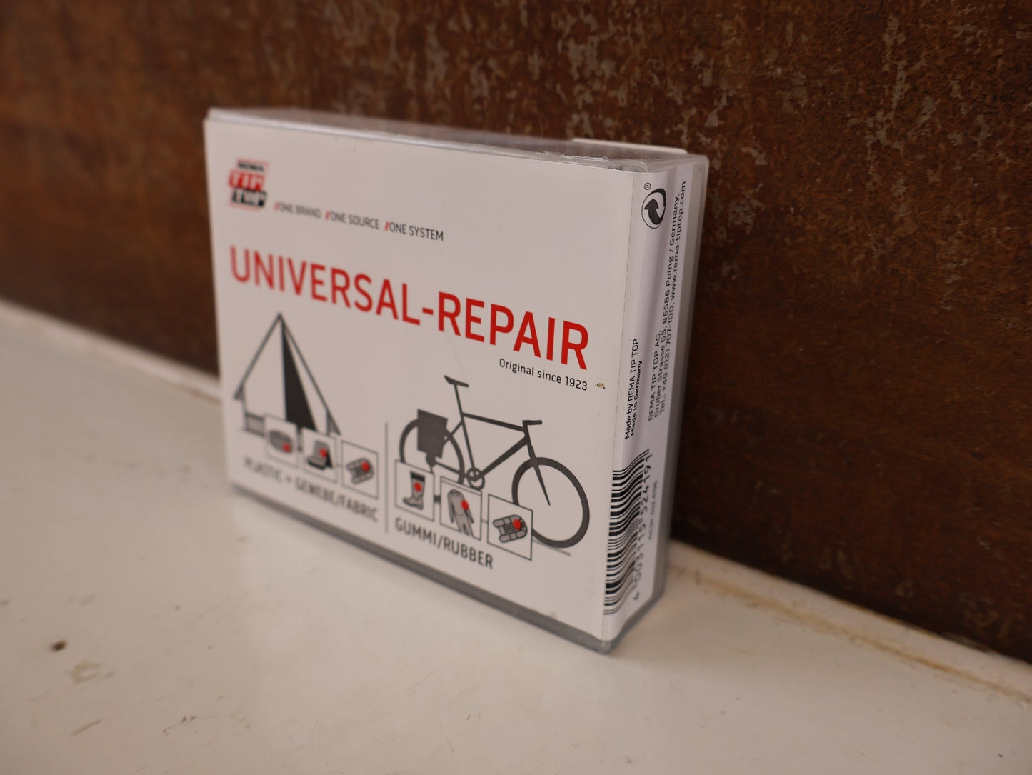Pflege & Wartung von Rema, REMA TIP TOP UNIVERSAL REPARATURSET FLICKBOX PU PVC vor USEDBIKES-OB.DE Hintergrund