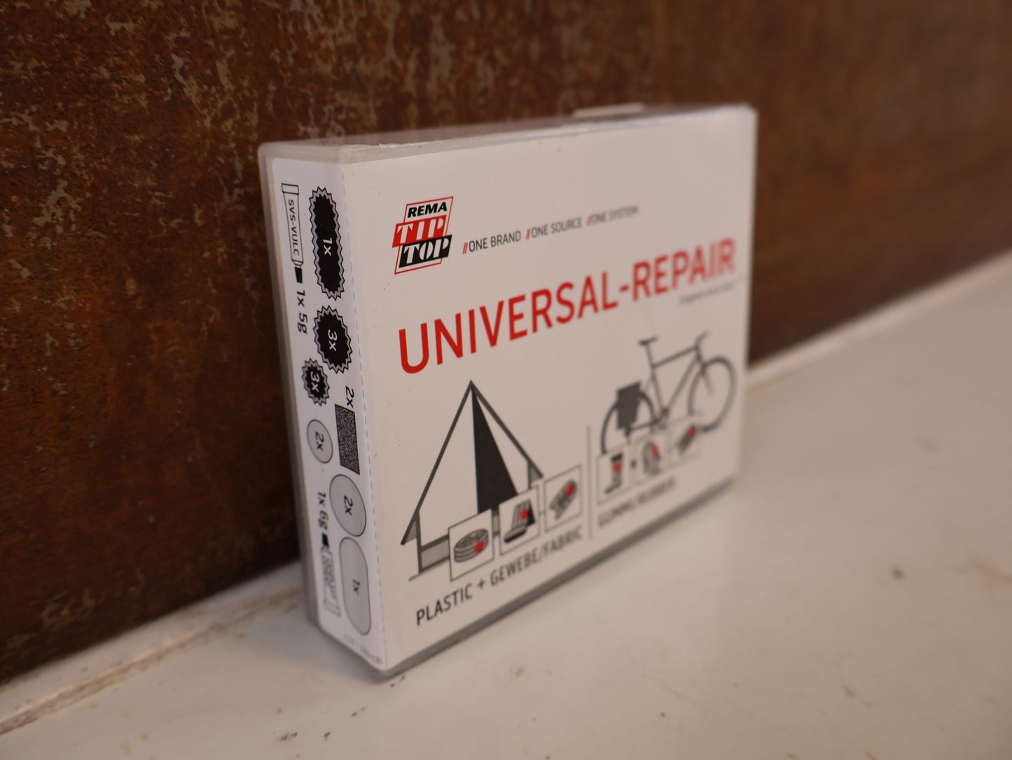 Pflege & Wartung von Rema, REMA TIP TOP UNIVERSAL REPARATURSET FLICKBOX PU PVC vor USEDBIKES-OB.DE Hintergrund