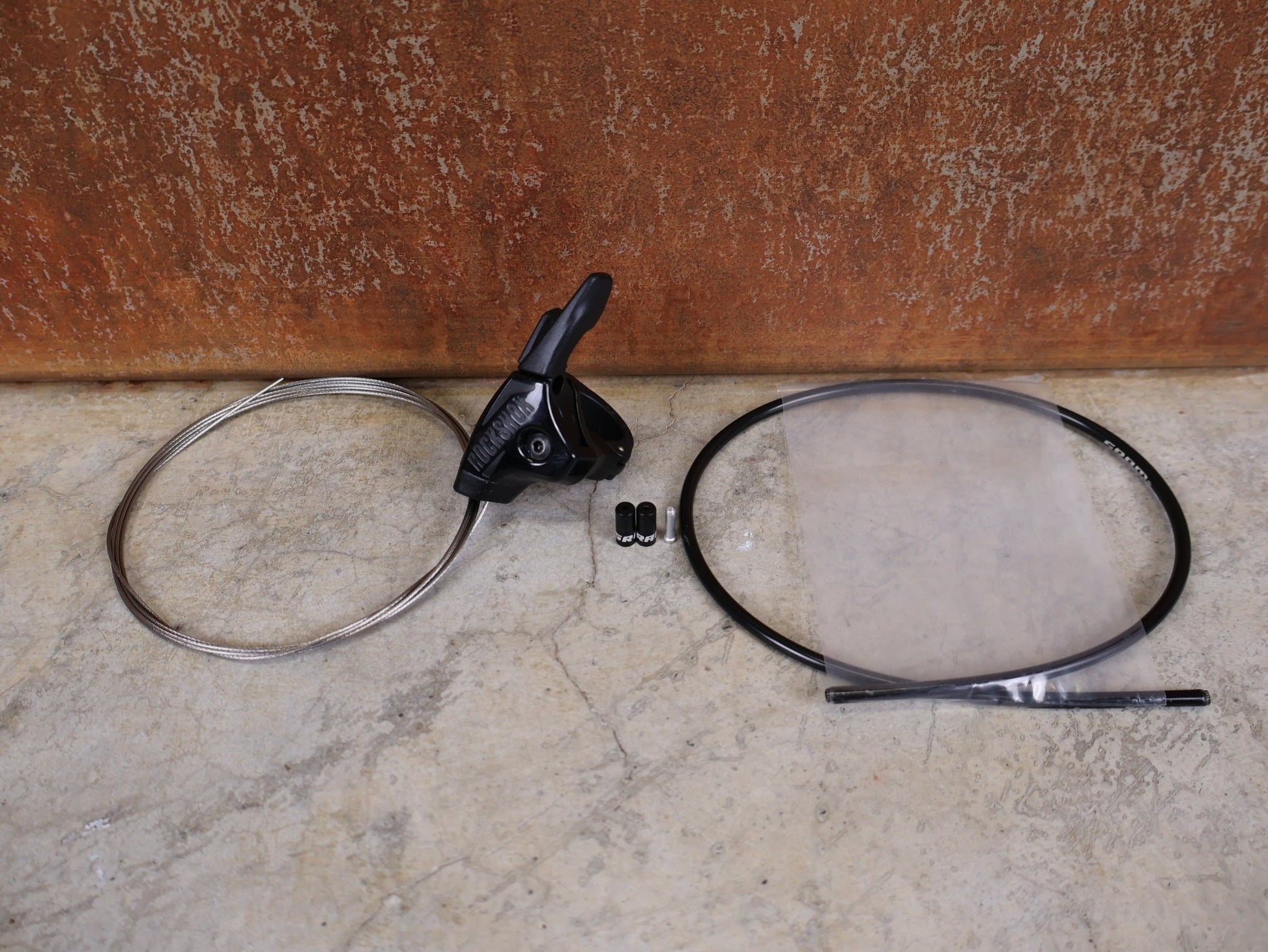 Zubehör von Sram, ROCKSHOX ONELOC REMOTE LOCKOUT HEBEL – FULL SPRINT – MTB vor USEDBIKES - OB.DE Hintergrund