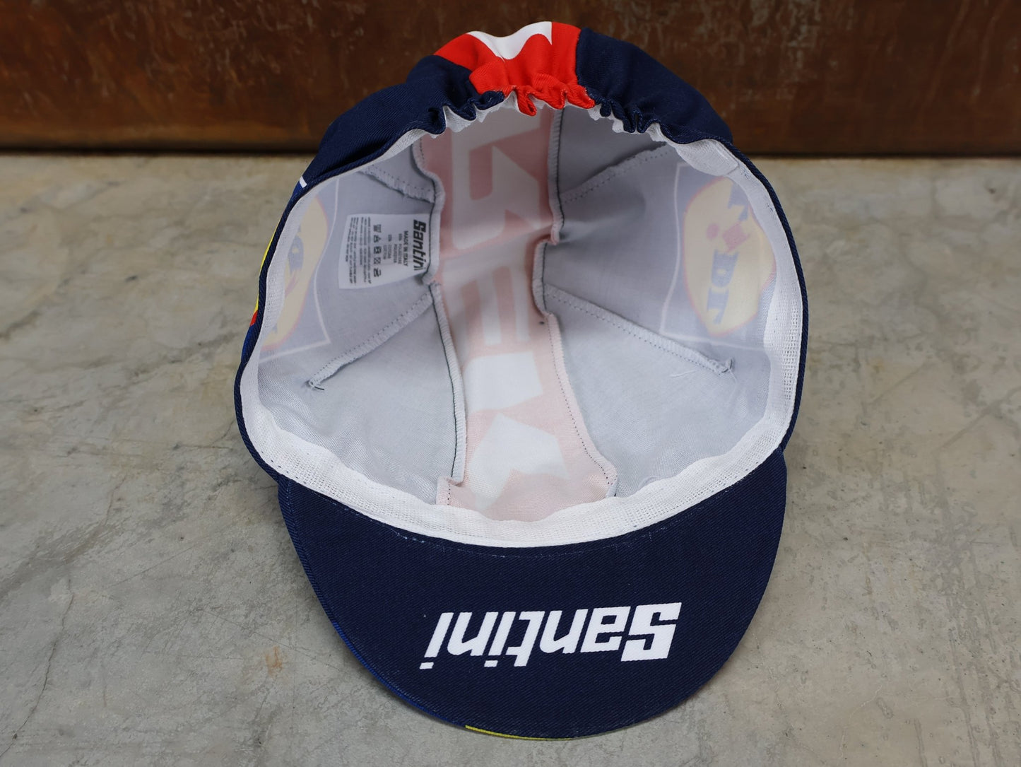 Kopfbedeckung von Santini, SANTINI – LIDL - TREK TEAM REPLICA FAHRRADMÜTZE / UNISEX / MODELL 5321093 vor USEDBIKES - OB.DE Hintergrund