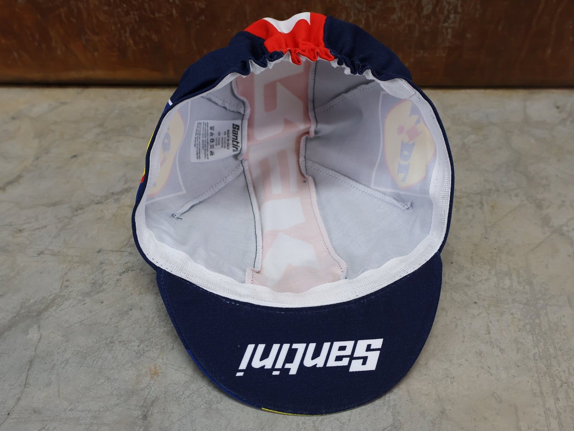 Kopfbedeckung von Santini, SANTINI – LIDL - TREK TEAM REPLICA FAHRRADMÜTZE / UNISEX / MODELL 5321093 vor USEDBIKES - OB.DE Hintergrund